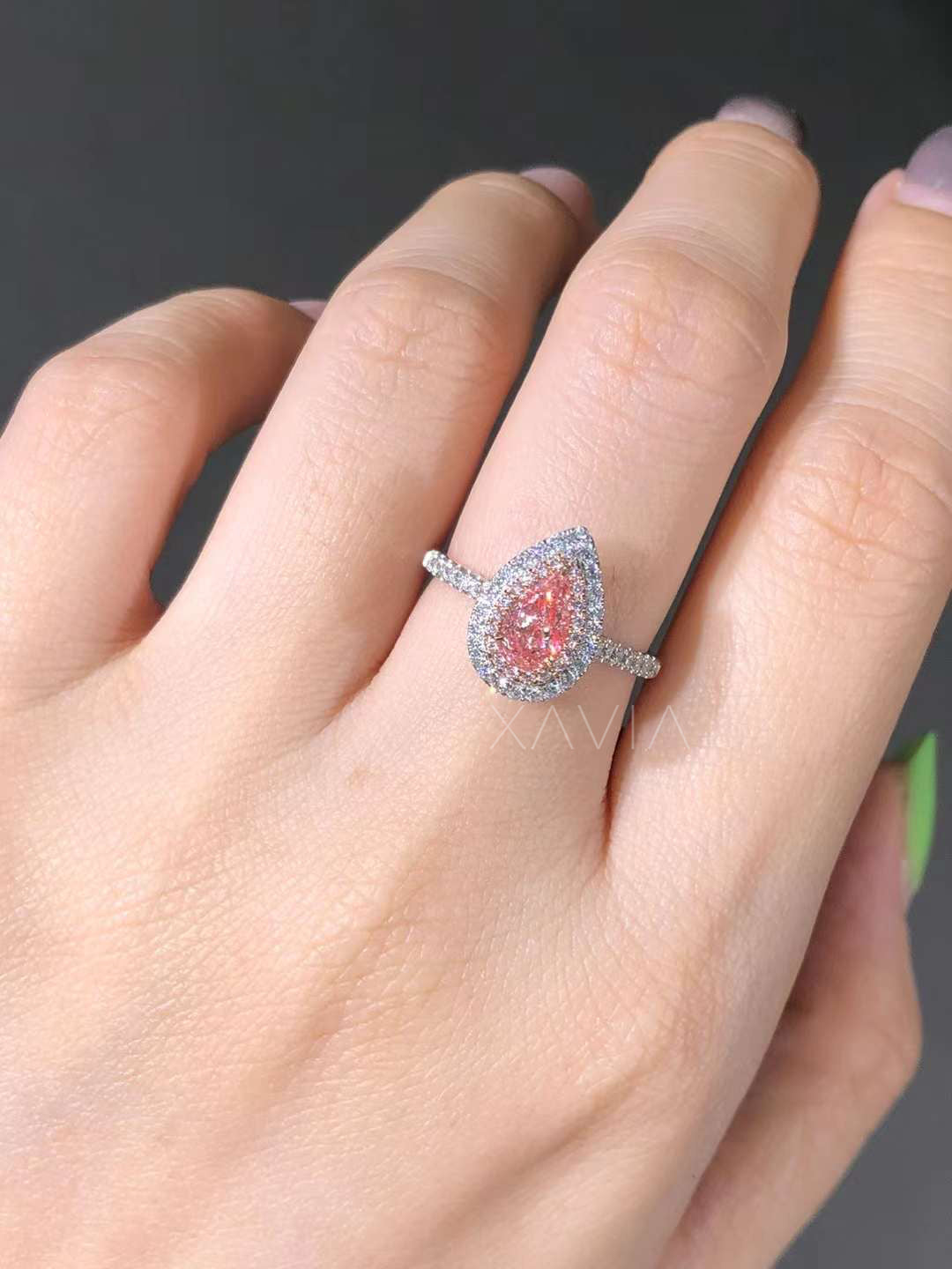 pink lab diamond ring with double halo and pave band worn on finger